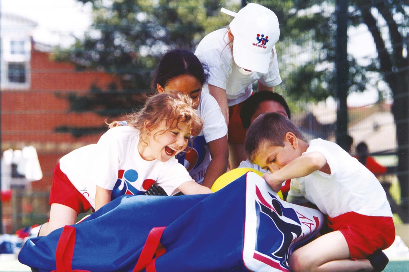 Children playing with tops equipment