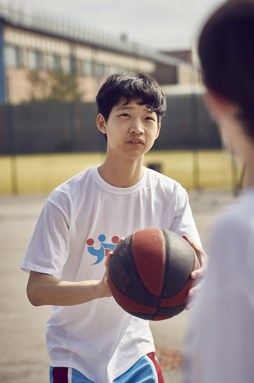 Young boy playing sport